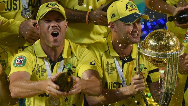 David Warner Michael Clarke pop the bubbles after victory in the 2015 World Cup final. AAP Image/Julian Smith.