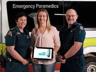 SPECIAL MOMENT: Kathy Wockner (centre), alongside paramedics Wendy Aitken (left) and David Hatchett, two of the ambulance staff who worked on her son Lucas when he was found unconscious and not breathing. . Picture: Matthew Newton