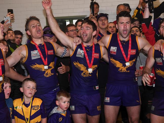 Ryan Mullett enjoys the premiership spoils. Picture: James Ross/AAP