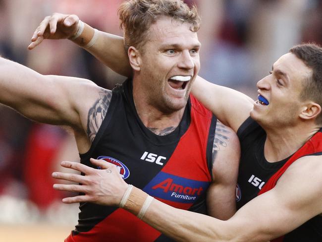 Jake Stringer of the Bombers (left) celebrates a goal during the Round 16 AFL match between the Essendon Bombers and the Sydney Swans at the MCG in Melbourne, Saturday, July 6, 2019. (AAP Image/Daniel Pockett) NO ARCHIVING, EDITORIAL USE ONLY