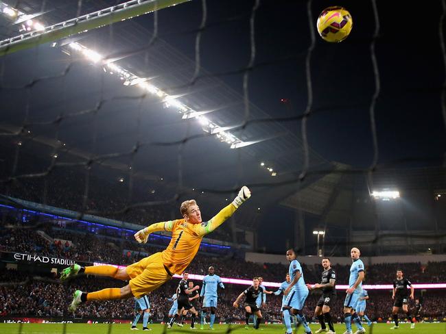 Ashley Barnes of Burnley beats Joe Hart of Manchester City to score the equalising goal.