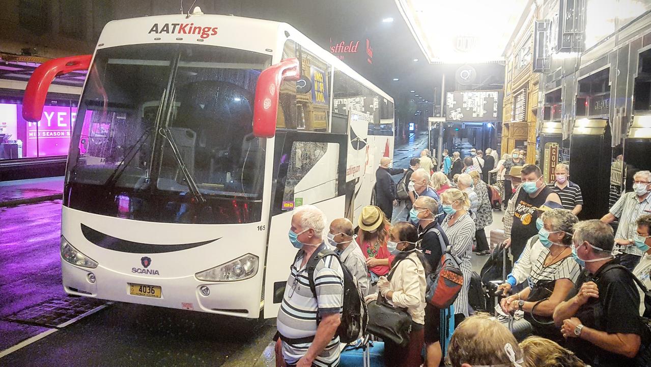 Norwegian Jewel passengers wore face masks as they arrived at the Swissotel in Sydney. Picture: Tom Huntley