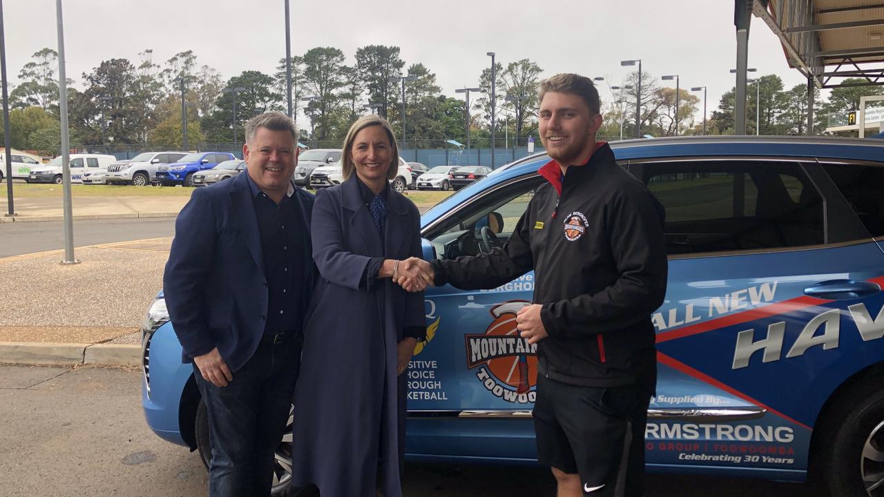 John and Jacqui Armstrong with Toowoomba Mountaineers QSL women's coach Matt Cox. Photo: Sean Teuma.