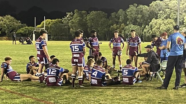 Coach Mick Roberts talks to his side.