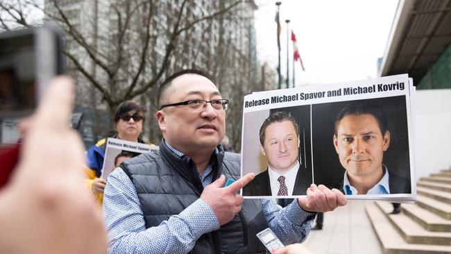 Louis Huang of Vancouver Freedom and Democracy for China calls for the release of Michael Spavor and Michael Kovrig. Picture: AFP