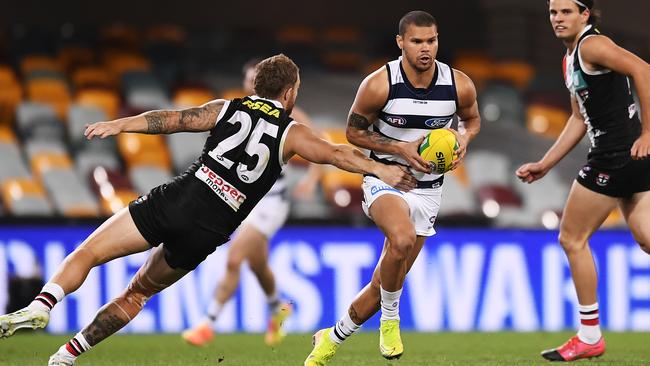 Brandan Parfitt of the Cats at his evasive bst, skipping yet another tackle. Picture: Albert Perez