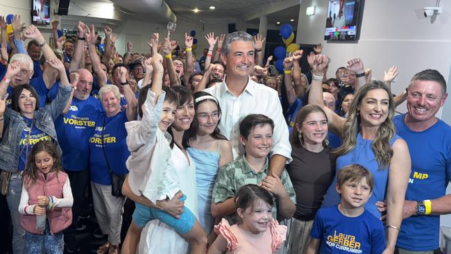 Gold Coast's new Burleigh MP Hermann Vorster celebrates with the LNP faithful alongside returned Currumbin LNP MP Laura Gerber.