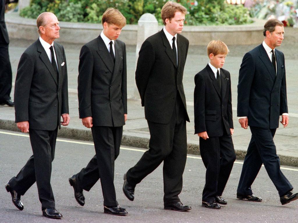 Prince Harry walking to his mother’s funeral with family members. (Photo by JEFF J MITCHELL / POOL / AFP)