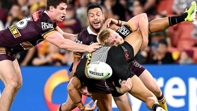 A committed Tom Dearden tackles Stephen Crichton at Suncorp Stadium. Picture: Getty Images