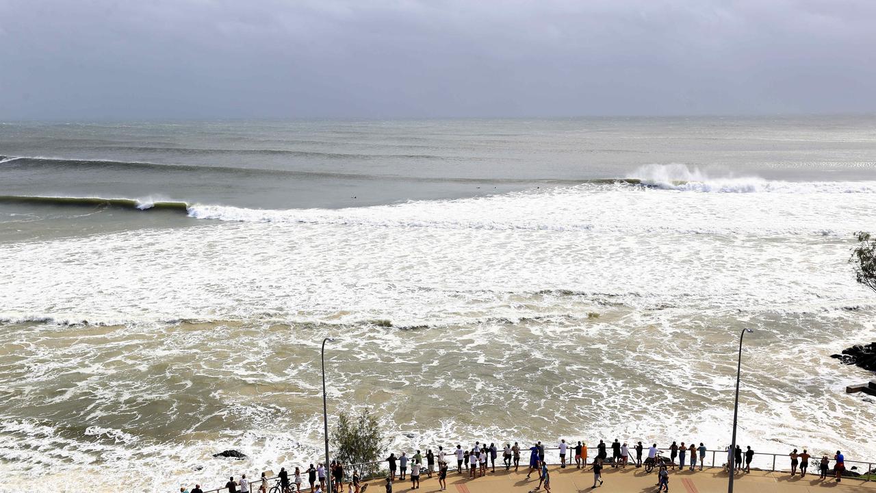 Thousands of people are out and about to watch the swell at Kirra as Cyclone Alfred sits off the coast. Picture: Adam Head