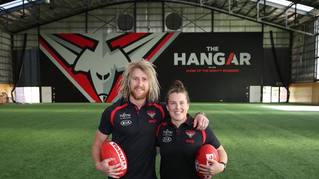 Dyson Heppell and Lauren Morecroft of the Bombers pose at "The Hangar"