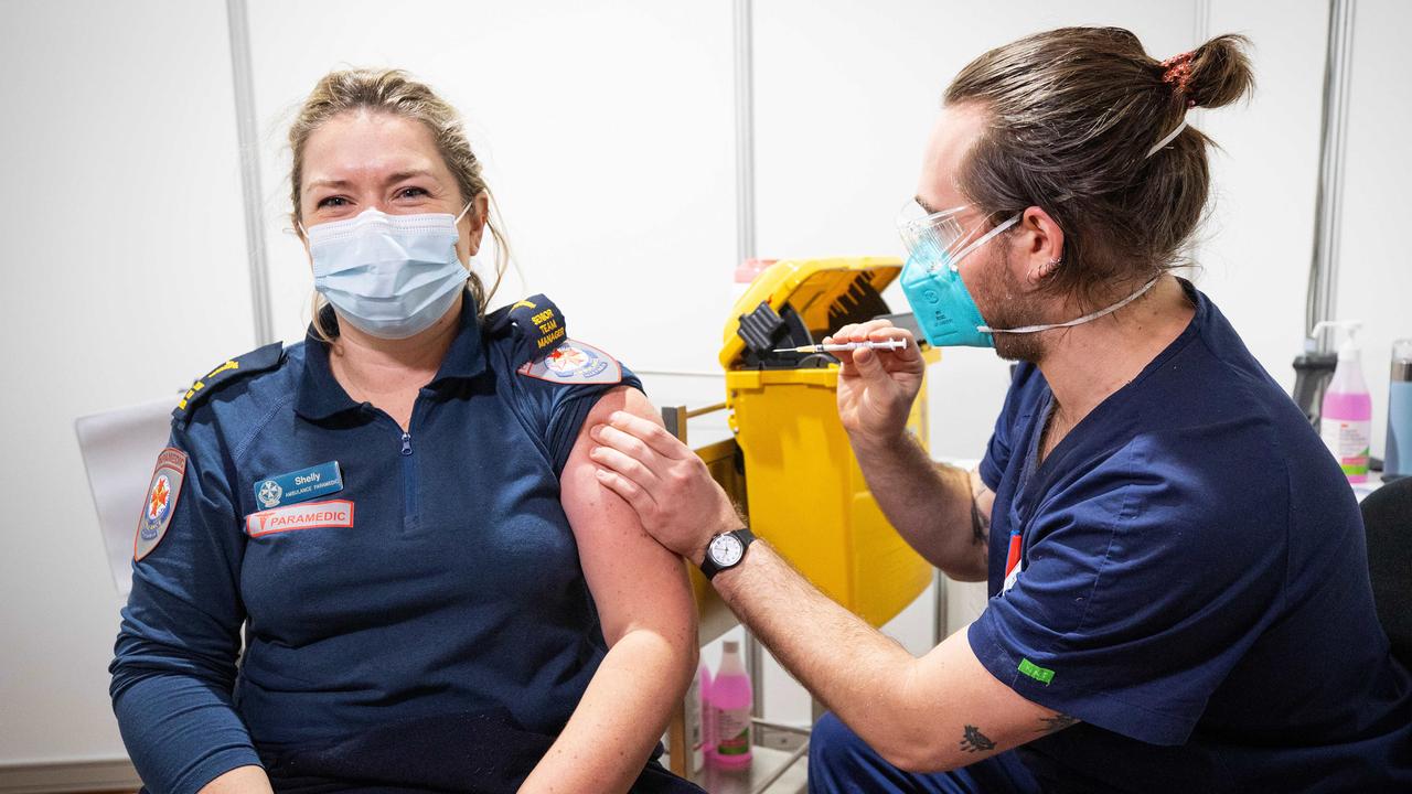 A paramedic receives her second dose of the AstraZeneca vaccine in Melbourne. Picture: Mark Stewart