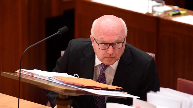 Attorney-General George Brandis has been caught in an open-mike moment.