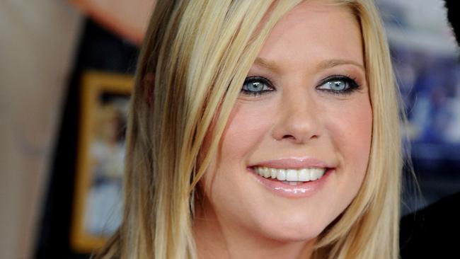 American actor Tara Reid poses for photographs at the American Pie: Reunion media call in front of the iconic Harry's Cafe de Wheels, Sydney, Tuesday, March. 6, 2012. American Pie: Reunion opens on April 5. (AAP Image/Tracey Nearmy) NO ARCHIVING