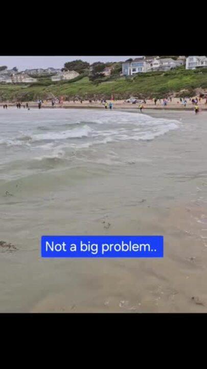 High Tide Encroaches on Parked Car on UK Beach