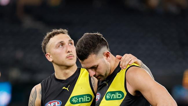 MELBOURNE, AUSTRALIA – AUG 11: Shai Bolton and Jack Graham of the Tigers look dejected after a loss during the 2024 AFL Round 22 match between the Richmond Tigers and the St Kilda Saints at Marvel Stadium on August 11, 2024 in Melbourne, Australia. (Photo by Dylan Burns/AFL Photos via Getty Images)