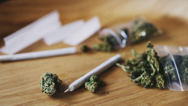 Shot of dried marijuana and a rolled joint. Cannabis clipseal bag generic image. Picture: iStock