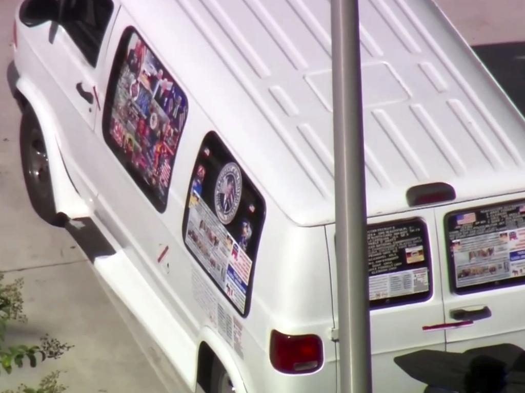 This frame grab from video provided by WPLG-TV shows a van parked in Plantation, Florida. The van, which has several stickers on the windows, including American flags, was covered by a tarp as it travelled to an unknown location. Picture: AP