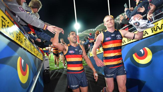 Eddie Betts and Sam Jacobs of the Crows head to the change rooms after the AFL qualifying final match between the Adelaide Crows and GWS Giants at the Adelaide Oval in Adelaide, on Thursday, September 7, 2017. (AAP Image/David Mariuz) NO ARCHIVING, EDITORIAL USE ONLY