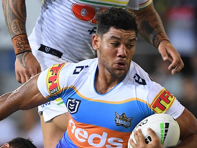 Brian Kelly  of the Titans takes the bal forward during the Round 5 NRL match between the Gold Coast Titans and the Penrith Panthers at CBUS Stadium on the Gold Coast, Friday, April 12, 2019. (AAP Image/Dave Hunt) NO ARCHIVING, EDITORIAL USE ONLY