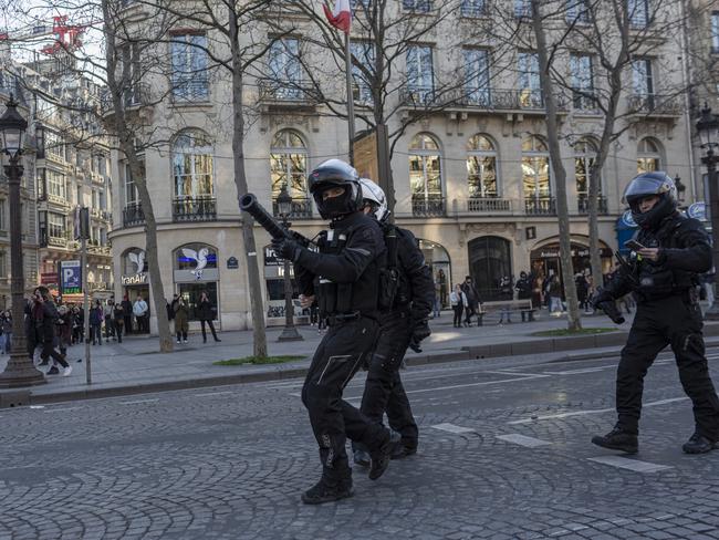 Police fire teargas as they disperse supporters of the Freedom Convoy on the Champs Elysees. Picture: Sam Tarling/Getty Images