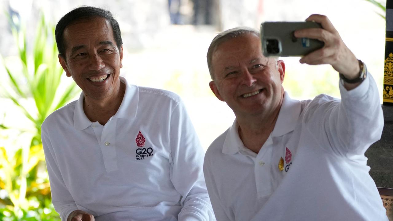 Anthony Albanese takes a selfie with Indonesia President Joko Widodo at the G20 Summit in Nusa Dua, on Bali on November 16, 2022. (Photo by Dita Alangkara / POOL / AFP)