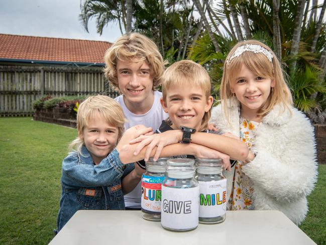 The Fletcher family, with their money jars, will be featured on Scott Pape's Foxtel show Money Movement. Picture: Brad Fleet