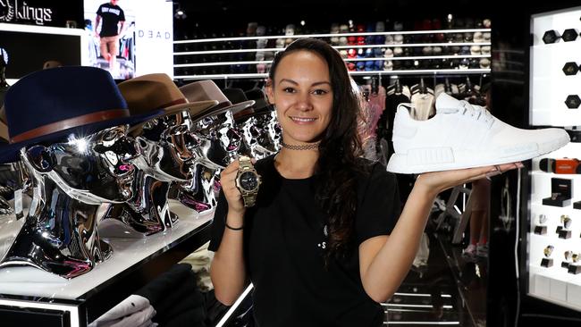 Jacinta May with a Casio G Shock MT-G watch and an already sold out Adidas NMD shoes at the Culture King store at Pacific Fair. Photo: Regi Varghese