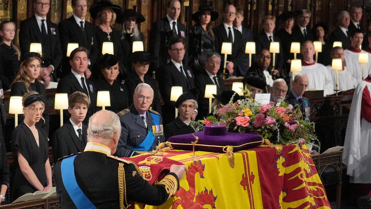 King Charles III places the Queen's Company Camp Colour of the Grenadier Guards on the coffin at the Committal Service. Picture: Getty Images