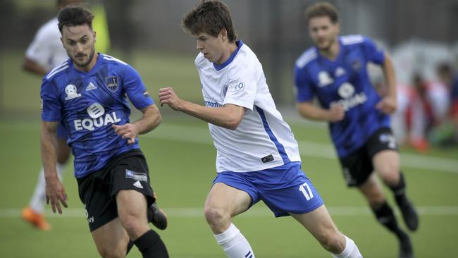 Adelaide Comets’ Jack Bladen and Adelaide Blue Eagle's Liam McCabe battle for the ball during their NPL SA clash at the weekend. Picture: AAP/Dean Martin