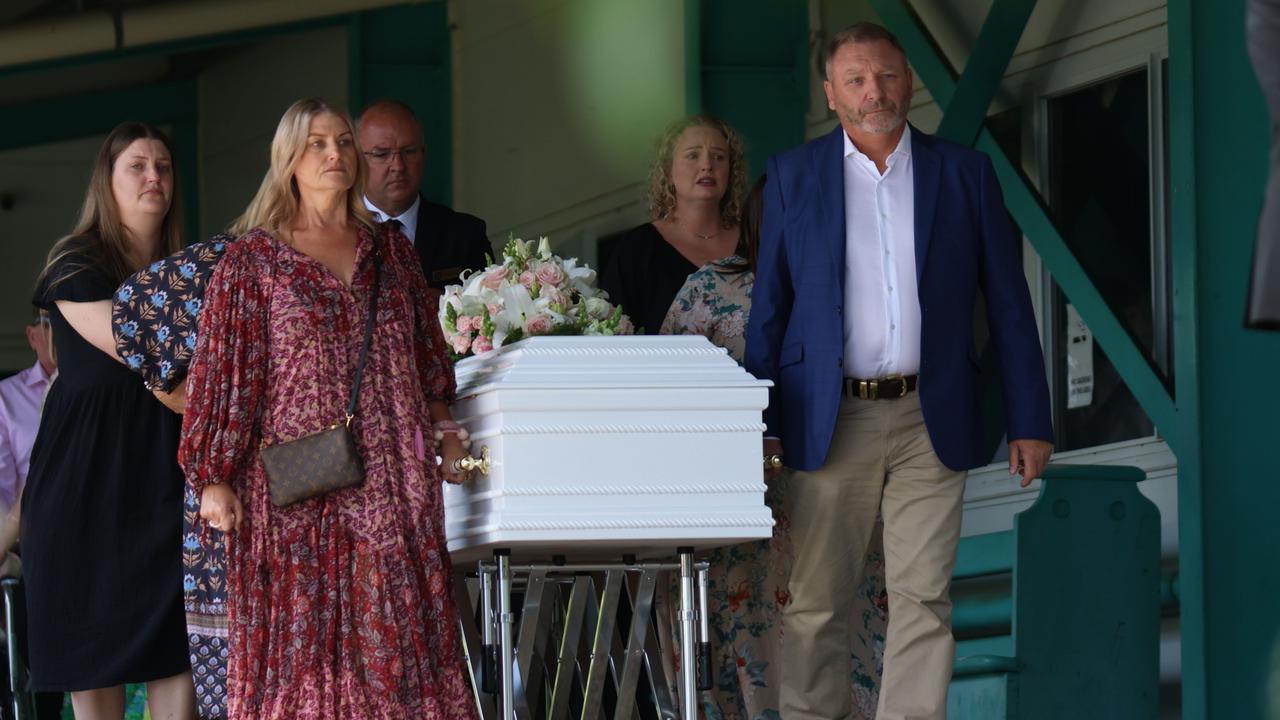 Anmaree and Gerry Black (front) carry the coffin holding their beloved daughter Tayla Black and granddaughter Murphy Margaret. PHOTO: Steve Vit