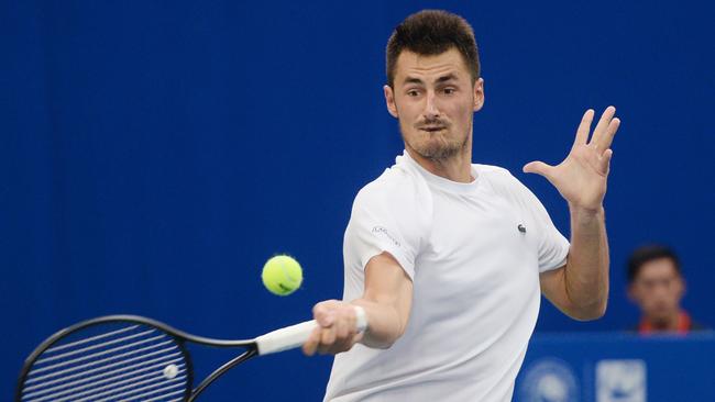 Bernard Tomic back when he won the Chengdu Open in 2018, saving match points to beat Fabio Fognini. (Photo by STR / AFP) / China OUT