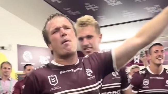 Comyn (pink shirt) in Manly’s change rooms after their win over the Roosters. Picture: Manly’s Facebook page