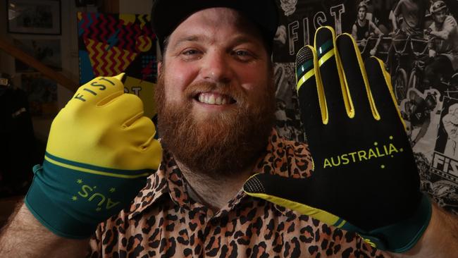 While Gold Coast athletes were winning gold in Tokyo in the BMX freestyle, Sam Moore, who owns a business based in Varsity Lakes called FIST, was proudly looking at their hands wearing his product. Picture Glenn Hampson