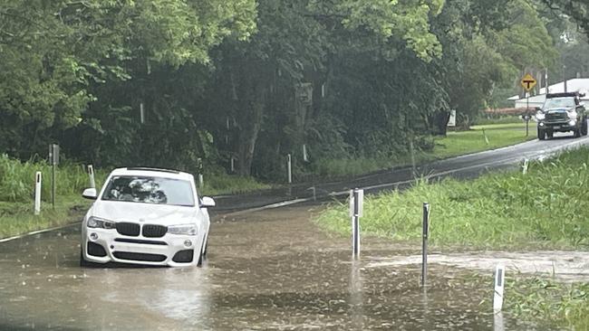 A BMW is stuck in floodwater on Collins Rd, Ninderry, as wild weather batters the Sunshine Coast on February 16. Picture: Iwan Jones