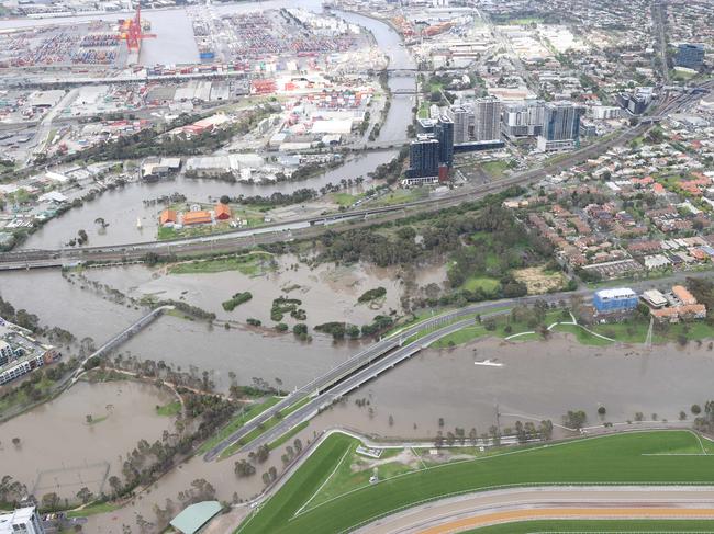 Aerial photos of flood waters enter homes and streets by the Maribyrnong River in the Flemington area.                       Picture: David Caird