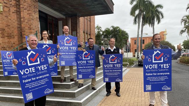 Rockhampton Regional Council says its position on the boundary vote hasn't changed and councillors stood outside Town Hall on Tuesday, June 7, with these signs.