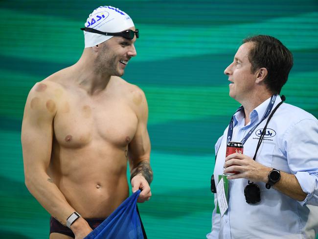 ADELAIDE, AUSTRALIA - JUNE 17: Kyle Chalmers chats to SASI coach Peter Bishop during the warm-up session of the Australian National Olympic Swimming Trials at SA Aquatic & Leisure Centre on June 17, 2021 in Adelaide, Australia. (Photo by Mark Brake/Getty Images)