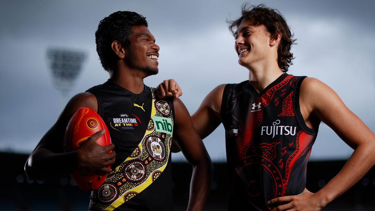 Richmond’s Maurice Rioli and Essendon’s Tex Wanganeen show off the special Sir Doug Nicholls Round jumpers to be worn at the MCG this Saturday night.