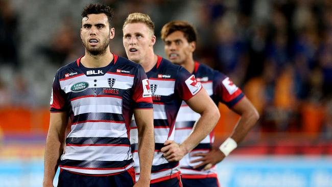 Rebels Jack Debreczeni, Reece Hodge and Ben Volavola try to work out where they went wrong.