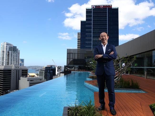 Iwan Sunito, founder of apartment developer Crown Group, at the rooftop pool of the Skye By Crown building in North Sydney.