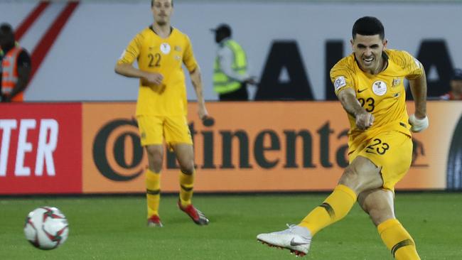 Australia's midfielder Tomas Rogic, right, kicks his goal ball, during the AFC Asian Cup group B soccer match between Australia and Syria at the Khalifa bin Zayed Stadium in Al Ain, United Arab Emirates, Tuesday, Jan. 15, 2019. (AP Photo/Hassan Ammar)