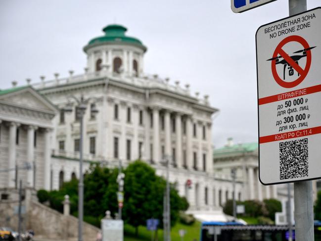 A "No Drone Zone" sign sits in central Moscow as it prohibits unmanned aerial vehicles (drones) flying over the area, on May 31, 2023. (Photo by Natalia KOLESNIKOVA / AFP)