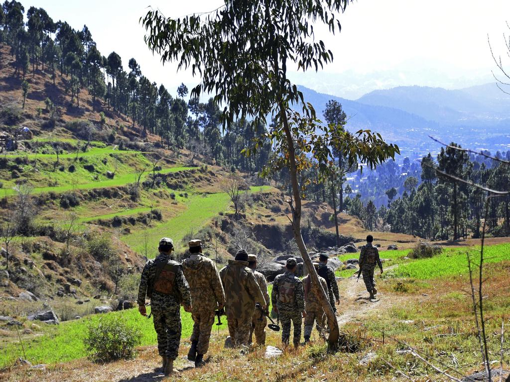 Pakistani soldiers patrol in the area where Indian planes were reportedly shot down by Pakistani forces. Picture: AP