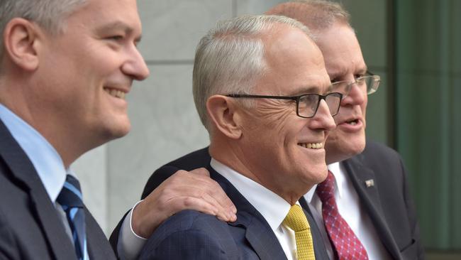 Australia's Finance Minister Mathias Cormann, Prime Minister Malcolm Turnbull and Treasurer Scott Morrison attend a press conference in Parliament House in Canberra on August 22 after the embattled leader narrowly survived a move to unseat him. Picture: AFP