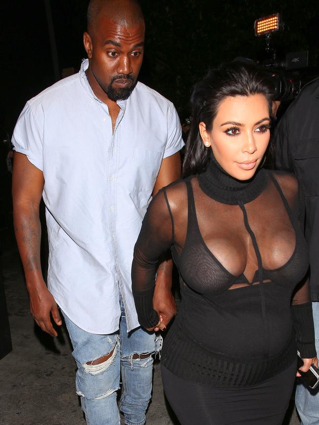 Kim and Kanye hold hands as they leave Kylie Jenner's 18th birthday party. Picture: Splash