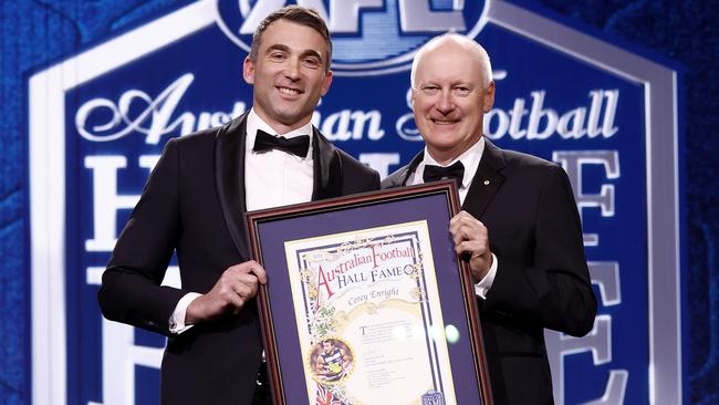 Hall of Fame inductee Corey Enright with Richard Goyder. (Photo by Michael Willson/AFL Photos/via Getty Images)