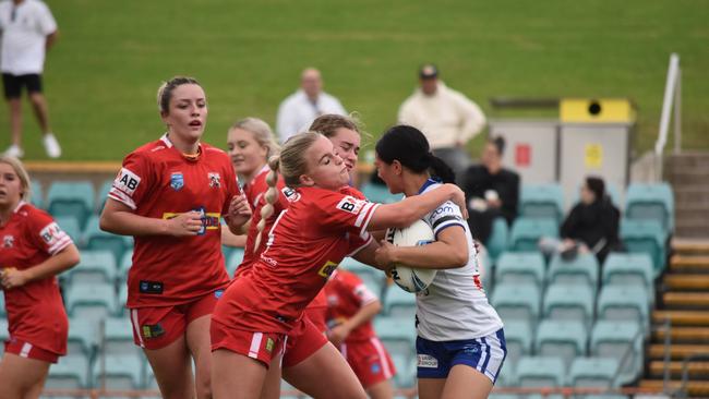 Charlotte Either hit hard in a tackle by Mia-Rose Walsh.