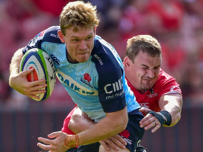 Bryce Hegarty tries to escape the clutches of Lions star Ruan Dreyer.