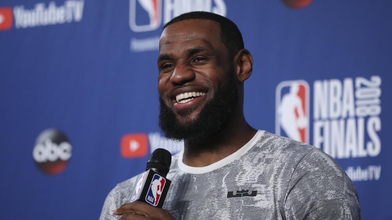Cleveland Cavaliers forward LeBron James takes questions at a press conference.